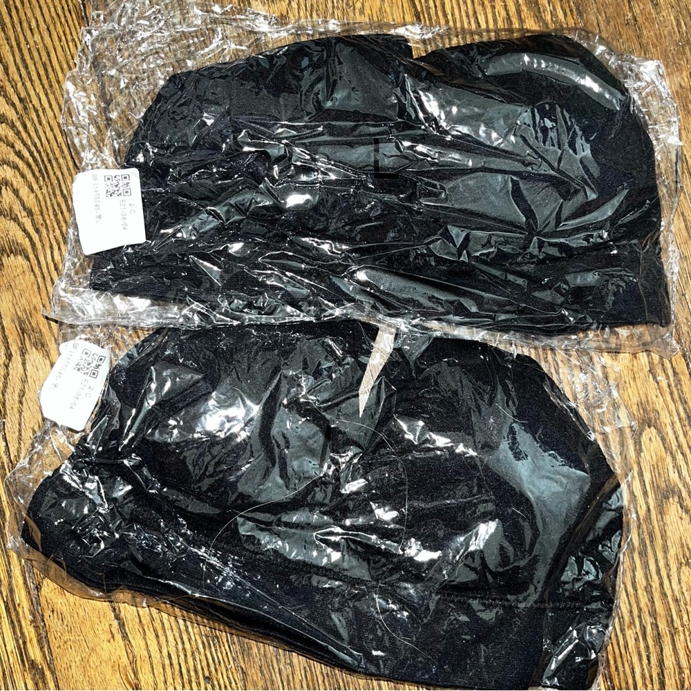 2 pairs of black sport bras